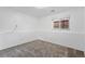 Neutral bedroom features gray carpeting and a window for natural light at 10731 W 63Rd Ave # A, Arvada, CO 80004