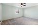 Vacant bedroom boasts fresh paint, a ceiling fan and a window for natural light at 10731 W 63Rd Ave # A, Arvada, CO 80004