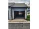Exterior view of a garage with an open door at 10731 W 63Rd Ave # A, Arvada, CO 80004