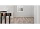 Carpeted hallway with natural light coming in from a large window at 10731 W 63Rd Ave # A, Arvada, CO 80004