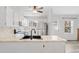 Bright kitchen featuring stainless steel appliances, marble countertops, and a modern black faucet at 10731 W 63Rd Ave # A, Arvada, CO 80004