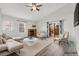 Bright living room with fireplace, vaulted ceiling, modern furniture, and access to patio at 10731 W 63Rd Ave # A, Arvada, CO 80004
