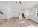 Open concept living room featuring an eat-in kitchen with stainless steel appliances and lots of light at 10731 W 63Rd Ave # A, Arvada, CO 80004