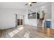 Inviting living room with hardwood floors, stairs to 2nd floor, and access to patio at 10731 W 63Rd Ave # A, Arvada, CO 80004