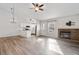 Open concept living room featuring a fireplace, an eat-in kitchen with stainless steel appliances at 10731 W 63Rd Ave # A, Arvada, CO 80004