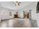 Bright living room with fireplace, vaulted ceiling, modern furniture, and access to patio at 10731 W 63Rd Ave # A, Arvada, CO 80004