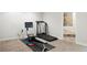 Basement with home gym, treadmill, and rowing machine at 5458 W Calhoun Ave, Littleton, CO 80123