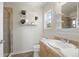 Clean bathroom with shower, toilet and single sink at 5458 W Calhoun Ave, Littleton, CO 80123