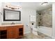 Basement bathroom with shower/tub combo and vanity at 5458 W Calhoun Ave, Littleton, CO 80123