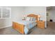 Basement bedroom with wooden bed frame and nightstands at 5458 W Calhoun Ave, Littleton, CO 80123