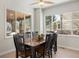 Bright dining area with a wooden table and six chairs at 5458 W Calhoun Ave, Littleton, CO 80123