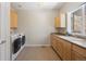 Laundry room with washer, dryer, and cabinets at 5458 W Calhoun Ave, Littleton, CO 80123