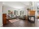 Living room with hardwood floors, fireplace, and comfortable seating at 5458 W Calhoun Ave, Littleton, CO 80123