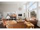 Bright living room with hardwood floors, fireplace, and large windows at 5458 W Calhoun Ave, Littleton, CO 80123