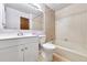Well-maintained bathroom with a tub, white vanity, and a large mirror at 910 S Walden St # 201, Aurora, CO 80017
