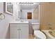 Traditional bathroom featuring a white vanity, a large mirror, and a combo tub and shower at 910 S Walden St # 201, Aurora, CO 80017