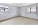 Serene bedroom with large windows offering plenty of natural light and soft, neutral carpeting at 910 S Walden St # 201, Aurora, CO 80017