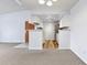 Inviting open floor plan showcases a modern kitchen with updated appliances and stylish flooring at 910 S Walden St # 201, Aurora, CO 80017