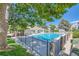 Community pool surrounded by mature trees and a secure fence for safe enjoyment, great for summer fun at 910 S Walden St # 201, Aurora, CO 80017