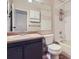 Bathroom features a combined tub and shower, toilet, and vanity at 4400 S Quebec St # D203, Denver, CO 80237