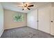 Bedroom with large window view, and a spacious closet at 4400 S Quebec St # D203, Denver, CO 80237
