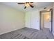 Bedroom with neutral walls, gray carpet and closet storage at 4400 S Quebec St # D203, Denver, CO 80237