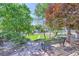 Common area featuring lush landscaping, stone pavers and mature trees at 4400 S Quebec St # D203, Denver, CO 80237