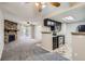 Inviting living space connecting the kitchen and living room, with updated finishes and natural light at 4400 S Quebec St # D203, Denver, CO 80237