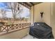 Enjoy this covered balcony with golf course views; grill included at 11962 W Long Cir # 103, Littleton, CO 80127