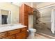 Well-appointed bathroom featuring updated vanity, walk-in shower, and tile floors at 11962 W Long Cir # 103, Littleton, CO 80127