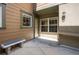 Inviting entrance features a bench and well-lit porch at 11962 W Long Cir # 103, Littleton, CO 80127