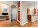 Hallway with hardwood floors featuring views of office, kitchen, and living spaces at 11962 W Long Cir # 103, Littleton, CO 80127