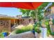 Backyard including grass lawn, patio, covered patio, and landscaping at 3530 E 8Th Ave, Denver, CO 80206
