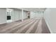 Spacious finished basement with carpet and an adjacent bathroom at 3530 E 8Th Ave, Denver, CO 80206