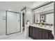 Bathroom featuring a glass enclosed shower and dual sink vanity at 3530 E 8Th Ave, Denver, CO 80206