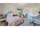 Bright bedroom with a comfortable bed, stylish decor, and natural light streaming through the window at 3530 E 8Th Ave, Denver, CO 80206