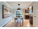 Bright dining room showcasing modern decor, with seamless flow to a modern kitchen and backyard access at 3530 E 8Th Ave, Denver, CO 80206