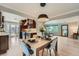 Open-concept living space with dining area flowing into a well-appointed kitchen and cozy living room at 3530 E 8Th Ave, Denver, CO 80206