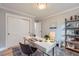 Well-organized home office with desk, shelving, and plenty of natural light for productivity at 3530 E 8Th Ave, Denver, CO 80206