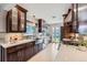 Contemporary kitchen featuring custom wood cabinets, quartz countertops, stainless steel sink and backyard view at 3530 E 8Th Ave, Denver, CO 80206