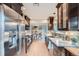 Bright kitchen showcasing modern appliances, custom wood cabinetry, and a seamless transition to the dining area at 3530 E 8Th Ave, Denver, CO 80206