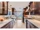 Bright kitchen with modern cabinetry, stainless appliances, quartz countertops and view of the back yard at 3530 E 8Th Ave, Denver, CO 80206