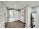 Spacious walk-in closet with custom shelves and a sliding barn door into the bathroom at 3530 E 8Th Ave, Denver, CO 80206