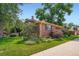 Expansive landscaped yard featuring lush greenery, mature trees, and colorful flower beds, provides a serene outdoor space at 3530 E 8Th Ave, Denver, CO 80206
