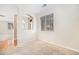 Cozy space with neutral carpet, a window, and view into a dining area at 11368 Navajo Cir # B, Denver, CO 80234