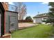 Brick home backyard with a well-kept lawn and concrete patio area at 35 S Albion St, Denver, CO 80246