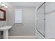 Bright bathroom with tiled floors features a bathtub and shower, and a window for lots of natural light at 35 S Albion St, Denver, CO 80246