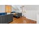 Bedroom with wood paneled wall features two beds and multiple windows, filling the room with light at 35 S Albion St, Denver, CO 80246