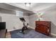 An exercise room featuring a stationary bike and a wooden dresser at 35 S Albion St, Denver, CO 80246