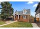 Charming brick home with an inviting front yard, patio area, and well-maintained landscaping at 35 S Albion St, Denver, CO 80246